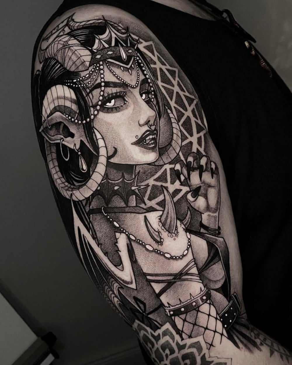 Heavy contrast detail in an Openmind fantasy tattoo
